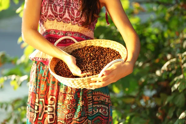 Female touching coffee beans — Stock Photo, Image