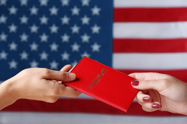 One hand giving passport to another — Stock Photo, Image