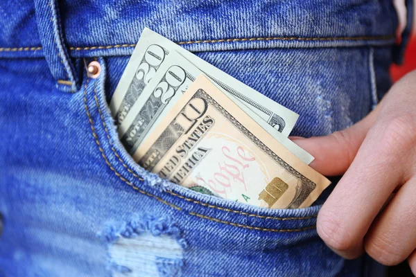 Billetes de dólar en jeans —  Fotos de Stock