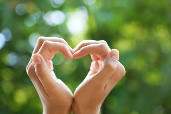 Hands in shape of love heart — Stock Photo, Image