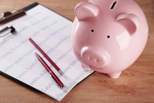 Pig moneybox and calculating equipment — Stock Photo, Image