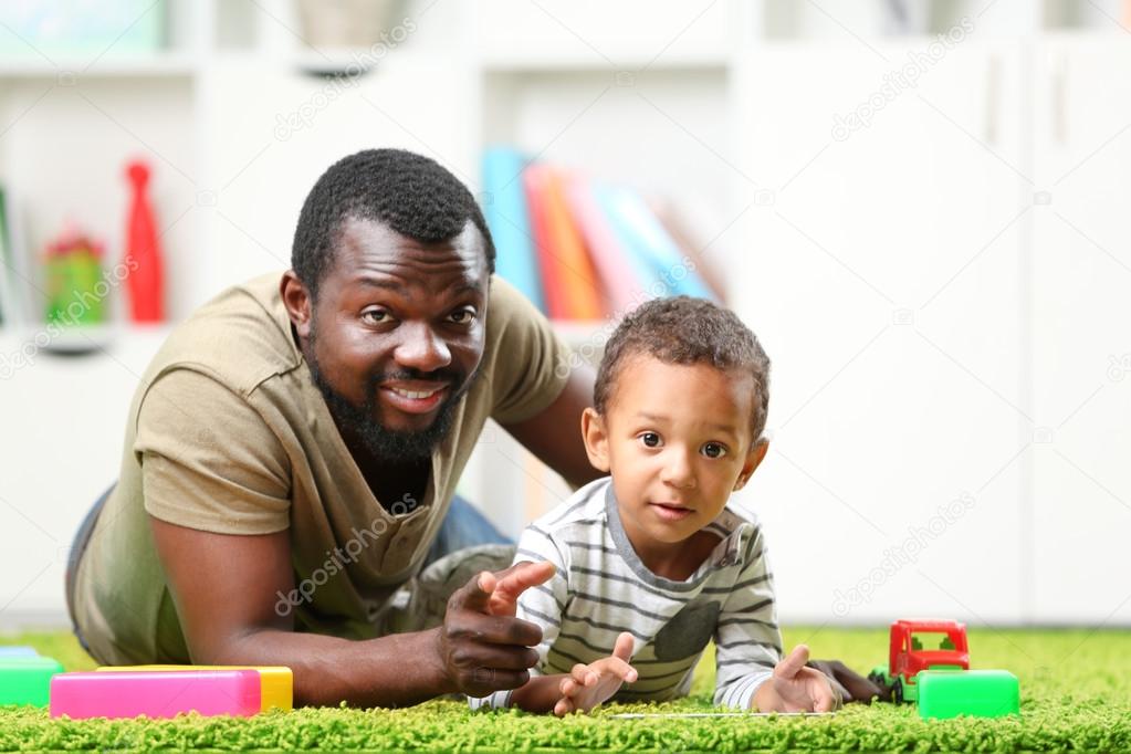 Father and son paying  