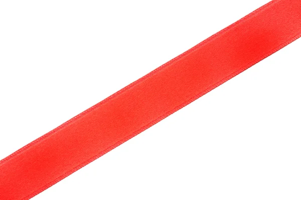 Μία κόκκινη διαγώνια κορδέλα, απομονωμένα σε λευκό — Φωτογραφία Αρχείου