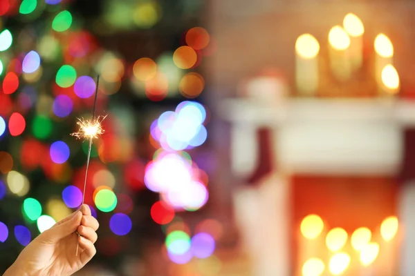 Female hand with Christmas sparkler — Stock Photo, Image