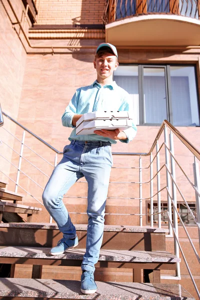 Delivery boy with pizza boxes — Stock Photo, Image