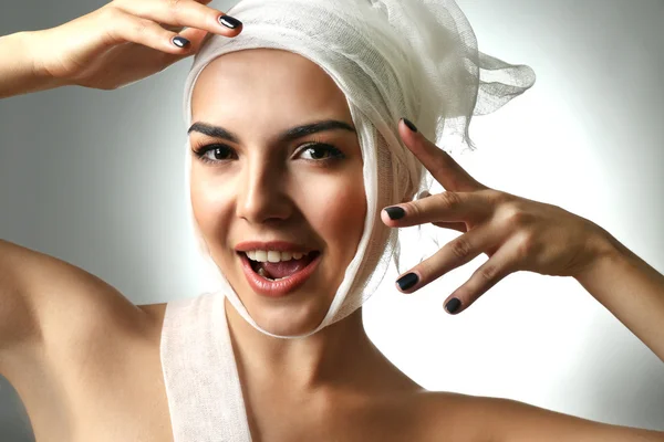 Woman with a gauze bandage — Stock Photo, Image