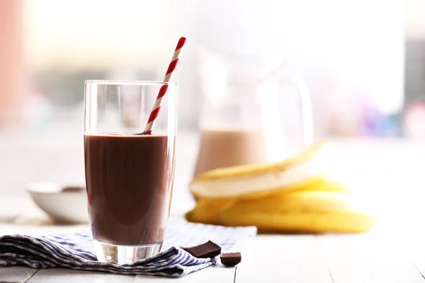 Glass of chocolate milk on table close-up — Stock Photo, Image