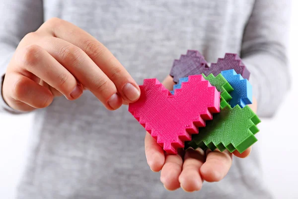 Plastic puzzle hearts — Stock Photo, Image