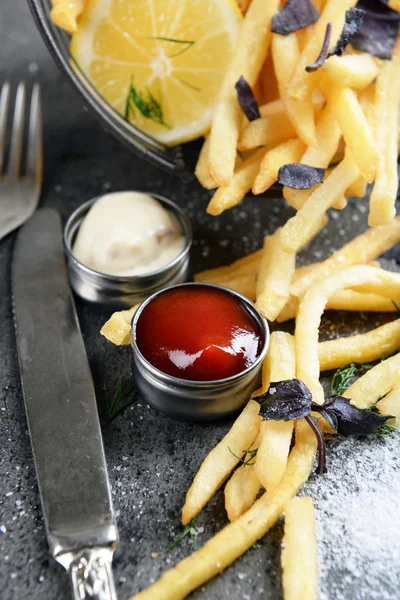 French fries with sauce and tableware — Stock Photo, Image