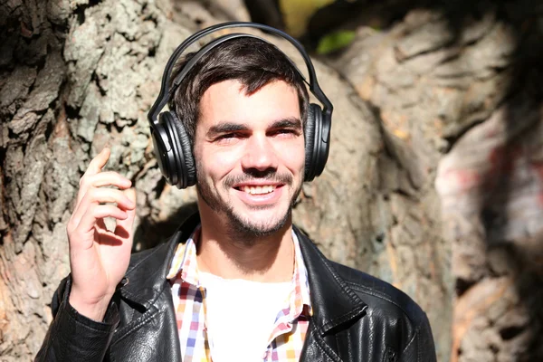 Young man in headphones — Stock Photo, Image