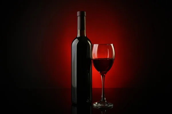 Wine glass and bottle — Stock Photo, Image