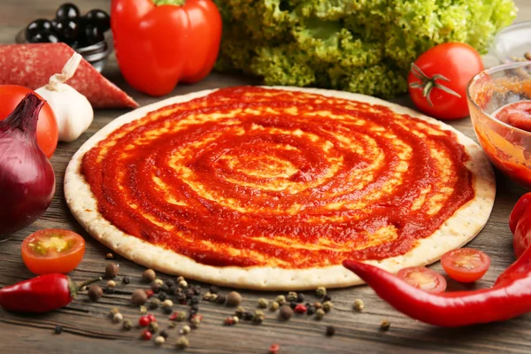 Dough basis with ketchup for pizza — Stock Photo, Image