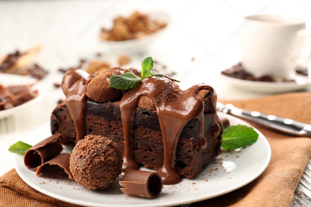 A piece of chocolate cake with mint