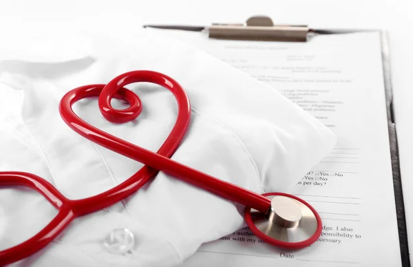 Red stethoscope, medical record