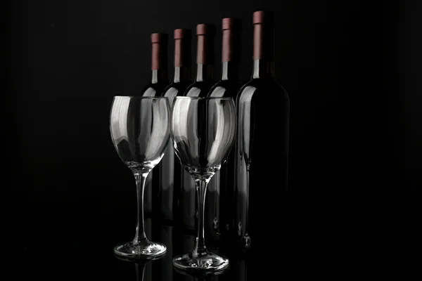 Glasses and wine bottles — Stock Photo, Image