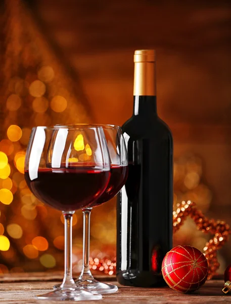 Red wine and Christmas ornaments — Stock Photo, Image