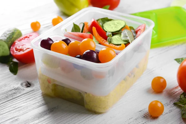 Tasty lunch in plastic containers — Stock Photo, Image