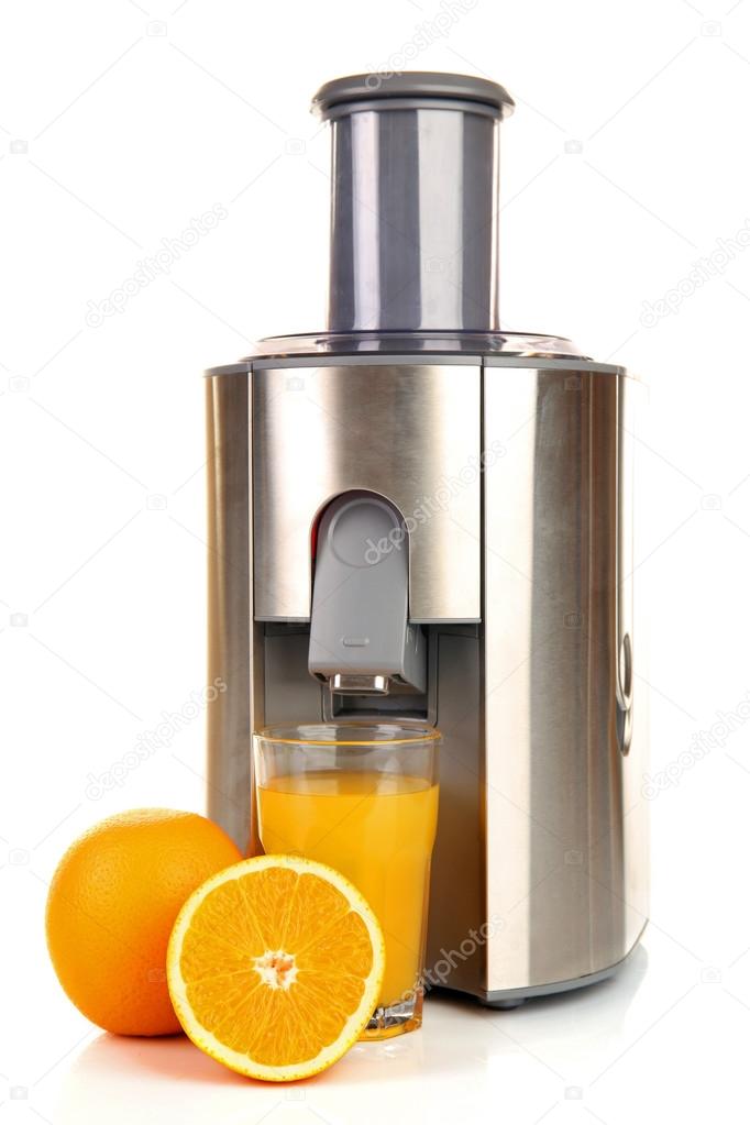 Stainless juice extractor with glass of orange juice isolated on white background