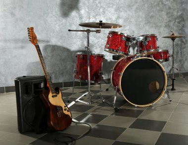 Drum set on brick wall background clipart