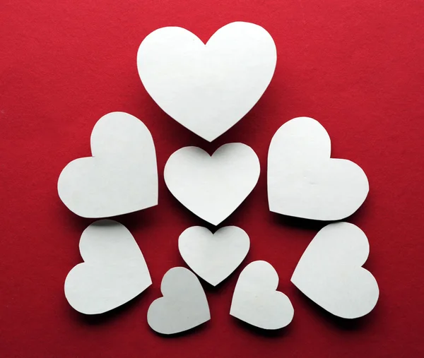 White paper hearts on dark pink background — Stock Photo, Image