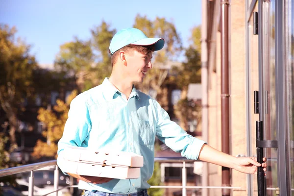 Delivery boy with pizza boxes — Stock Photo, Image