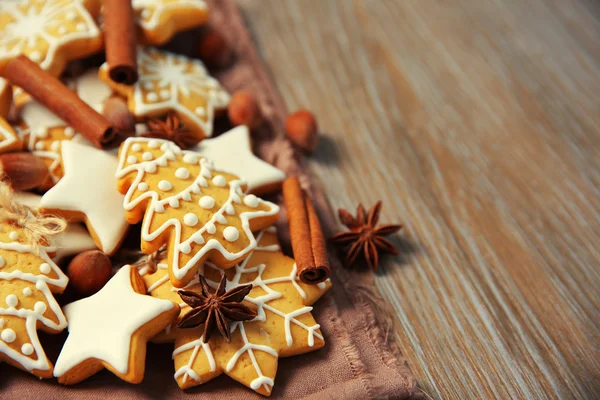 Christmas cookies with spices on wooden table — Stock Photo, Image