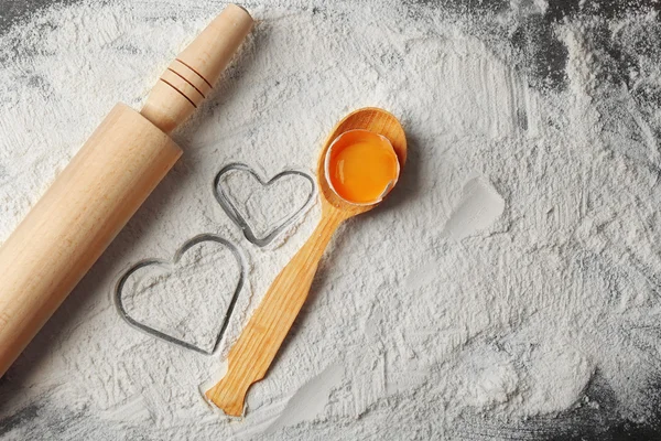 Hearts of flour and rolling pin — Stock Photo, Image