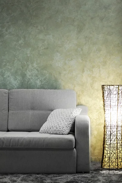 Comfortable sofa and modern lamp — Stock Photo, Image
