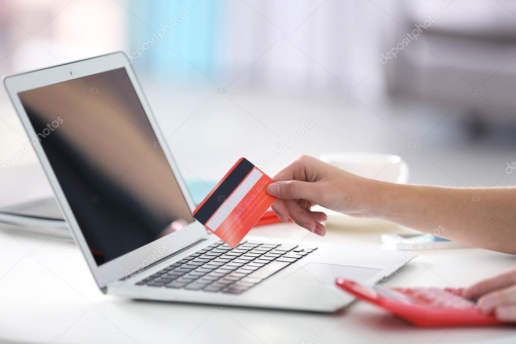 Female making online payment, close up