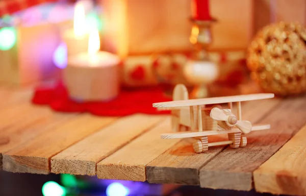 Wooden plane on the decorated table, close up — Stock Photo, Image