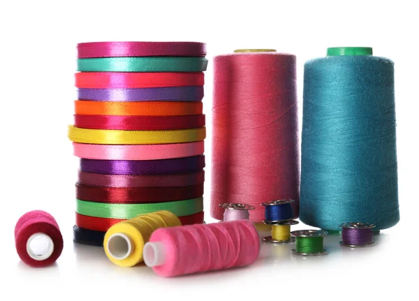 Spools of color ribbon and thread, isolated on white — Stock Photo, Image