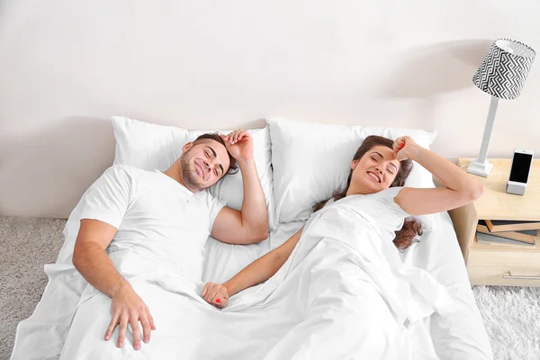 Happy couple waking up — Stock Photo, Image