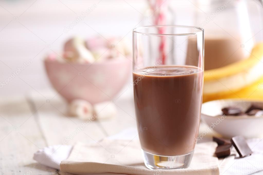 Glass Of Chocolate Milk On Table Close Up Stock Photo By C Belchonock