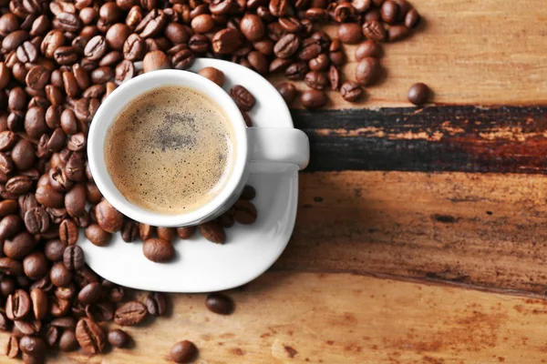 Cup of coffee and coffee grains — Stock Photo, Image