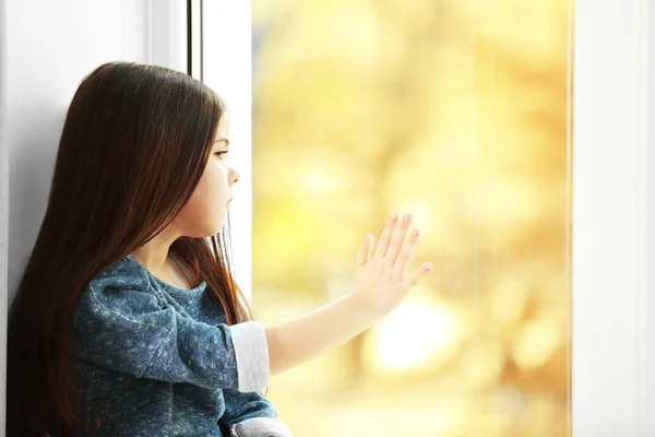 Little girl waiting for someone