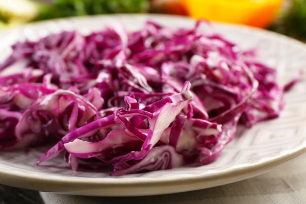 Red cabbage salad served on plate closeup — Stock Photo, Image