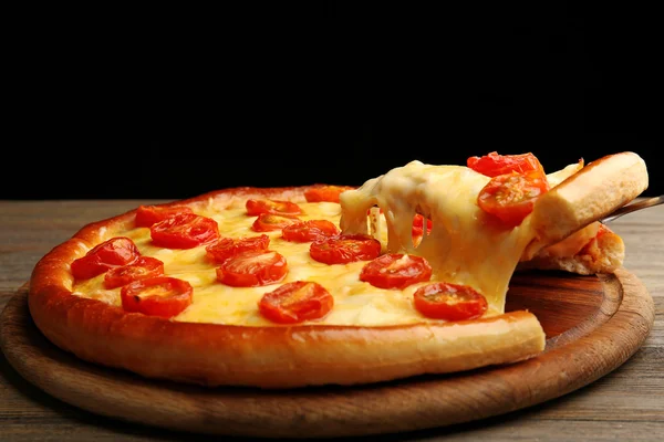 Pizza Margherita and removed slice on dark background — Stock Photo, Image