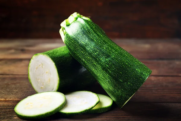 Fresh zucchini on wooden background — Stock Photo, Image