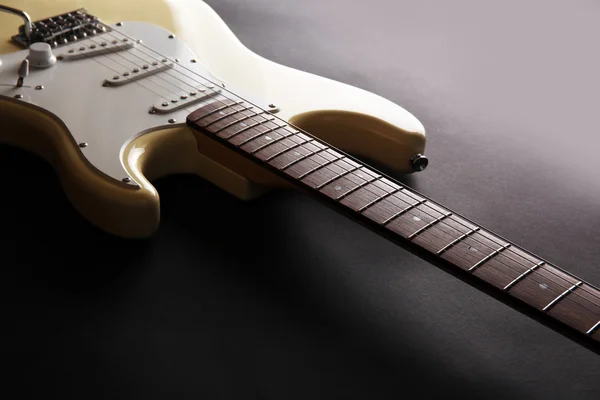 Part of white electric guitar, on black background — Stock Photo, Image