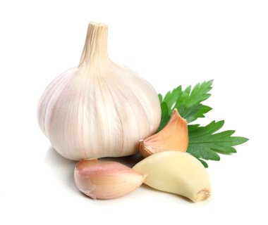 Garlic with leaves of parsley isolated on white clipart