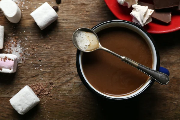 Cup of coffee with sweets on wooden background — Stock Photo, Image