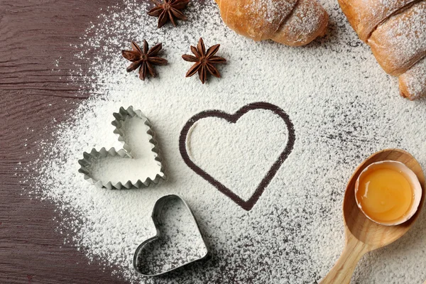 Heart of flour, croissant and spices — Stock Photo, Image