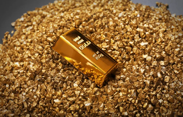 Gold bars on nugget grains background, close-up — Stock Photo, Image