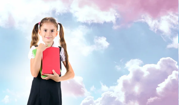 Schoolgirl on blue sky — Stock Photo, Image