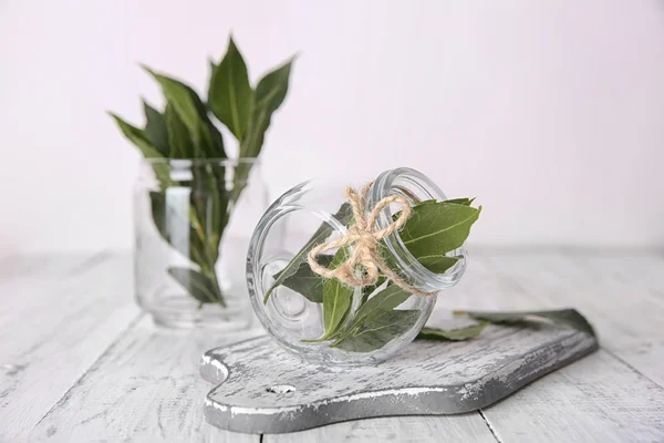 Fresh bay leaves in glass jars — Stock Photo, Image