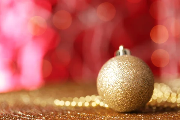 Christmas ball on abstract shiny background — Stock Photo, Image