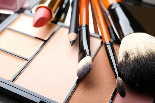 Cosmetics on dark background, closeup — Stock Photo, Image