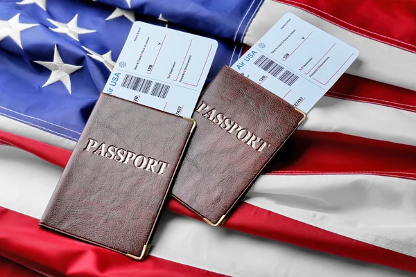 Passports, tickets lying on  Flag — Stock Photo, Image