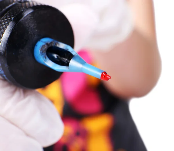 Tattoo machine with red paint — Stock Photo, Image