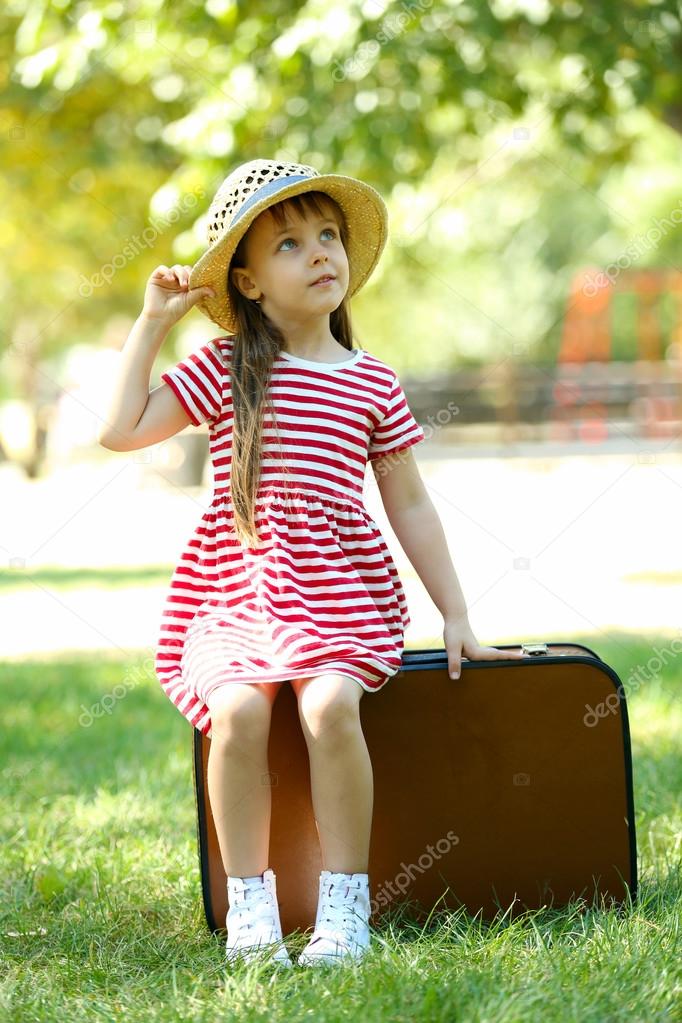 little girl with suitcase